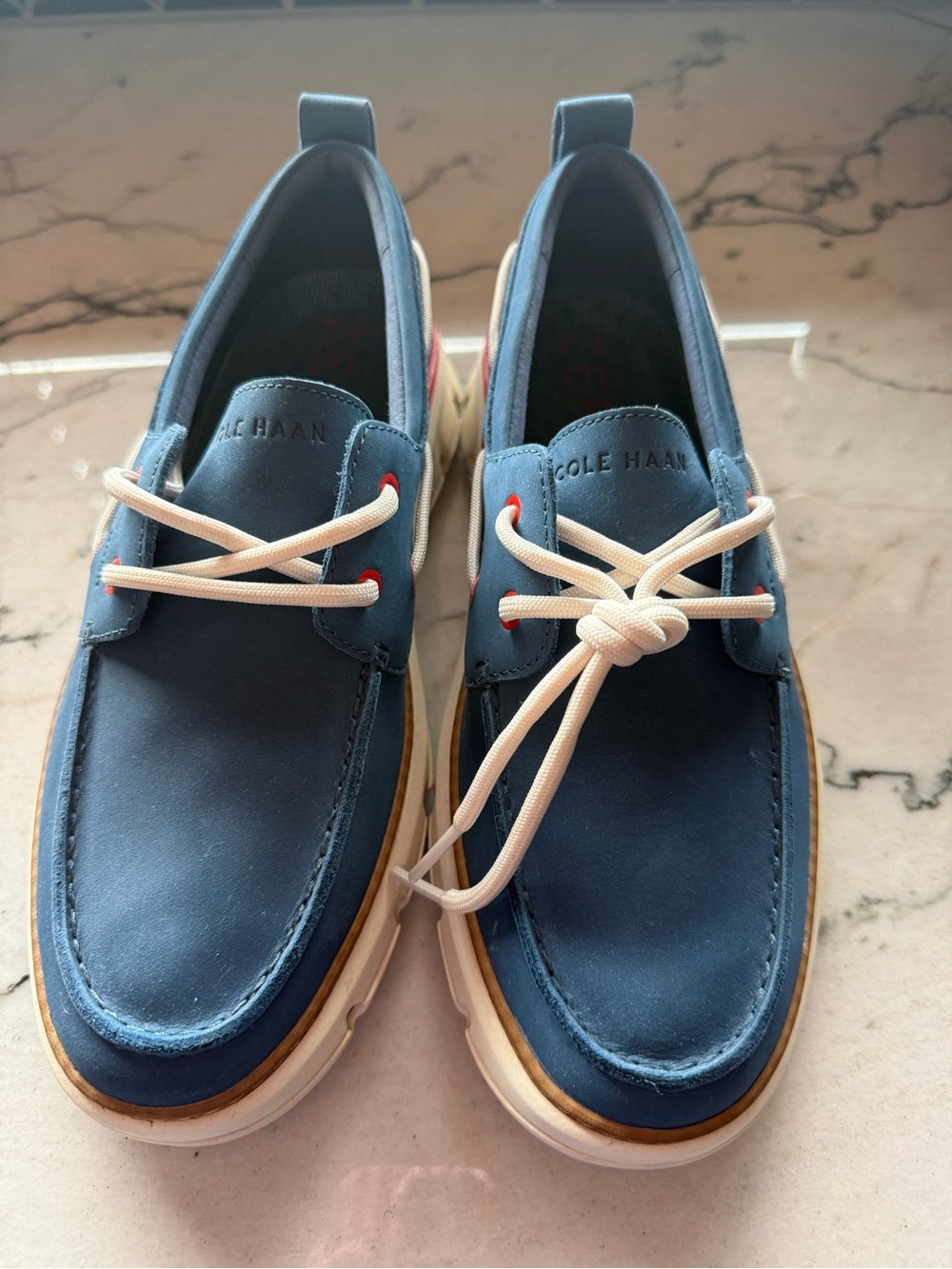 Cole Haan women’s Navy Blue Boat Shoes with Cream Laces
